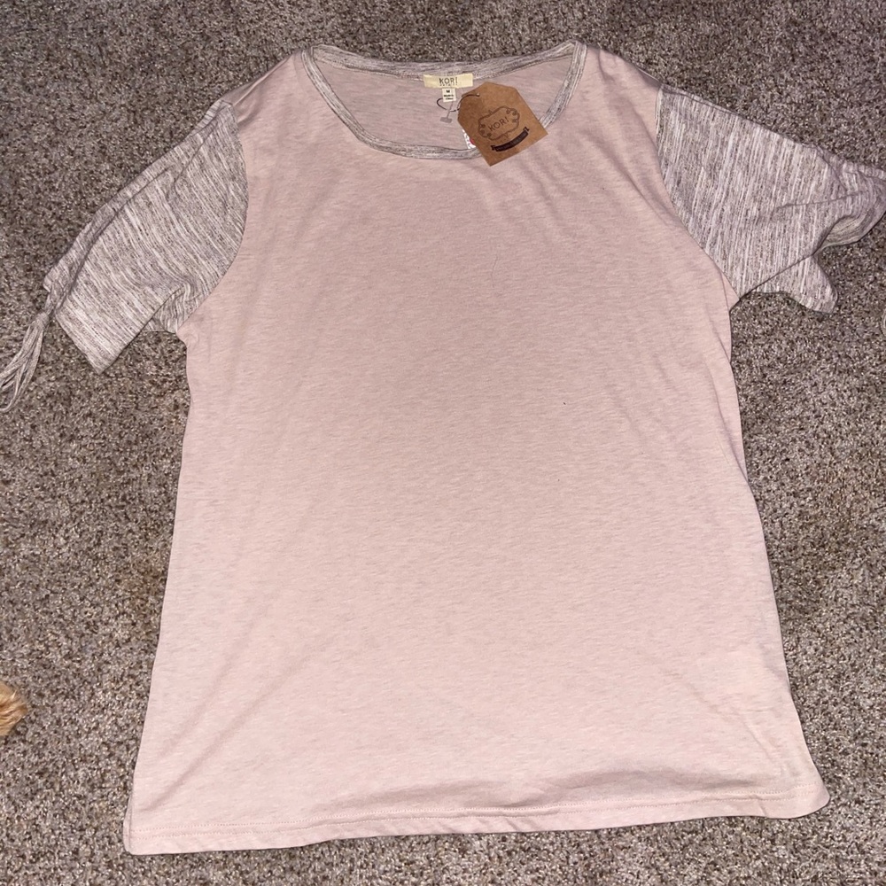 A pink kori top with ties